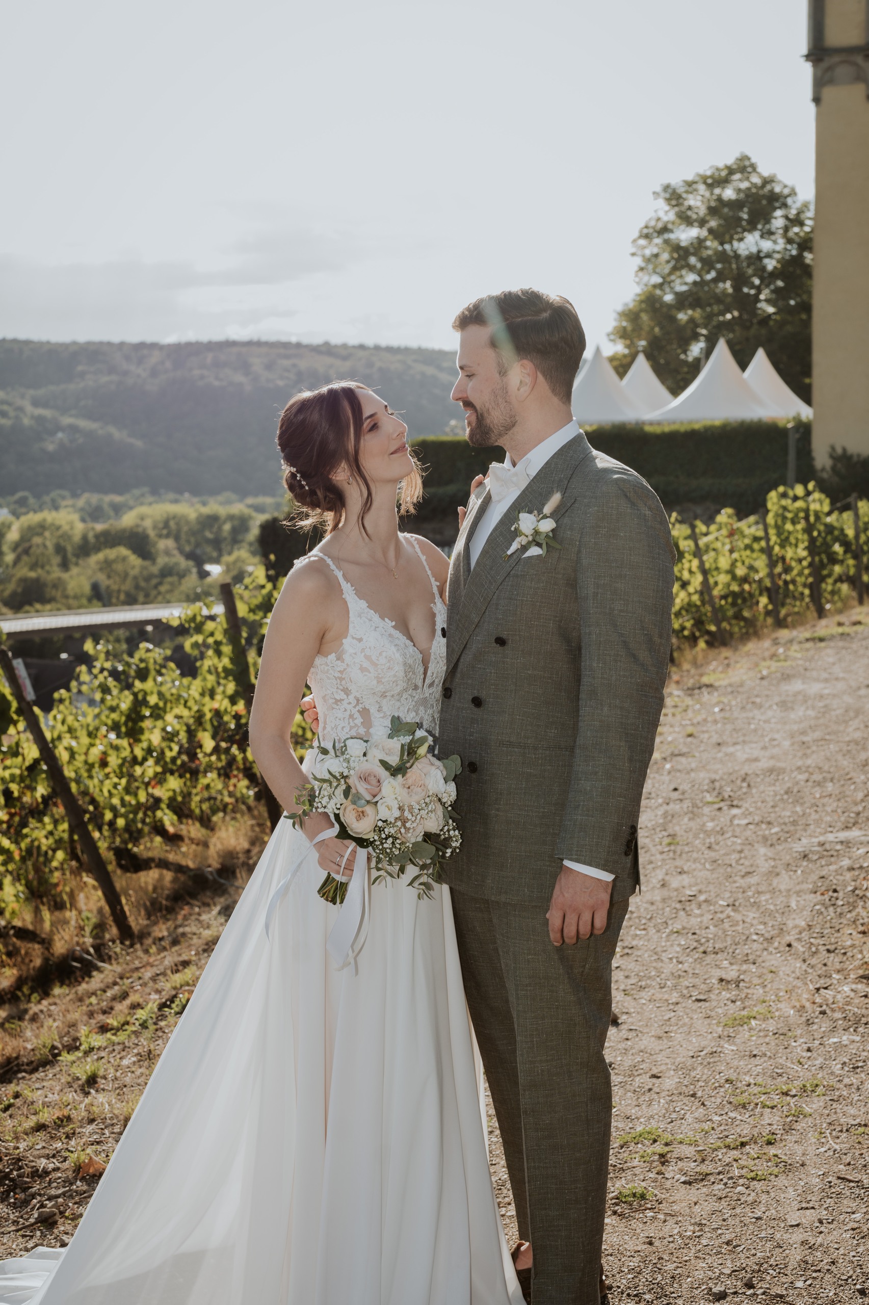 Lea and Pascal among the vines in the evening light.
