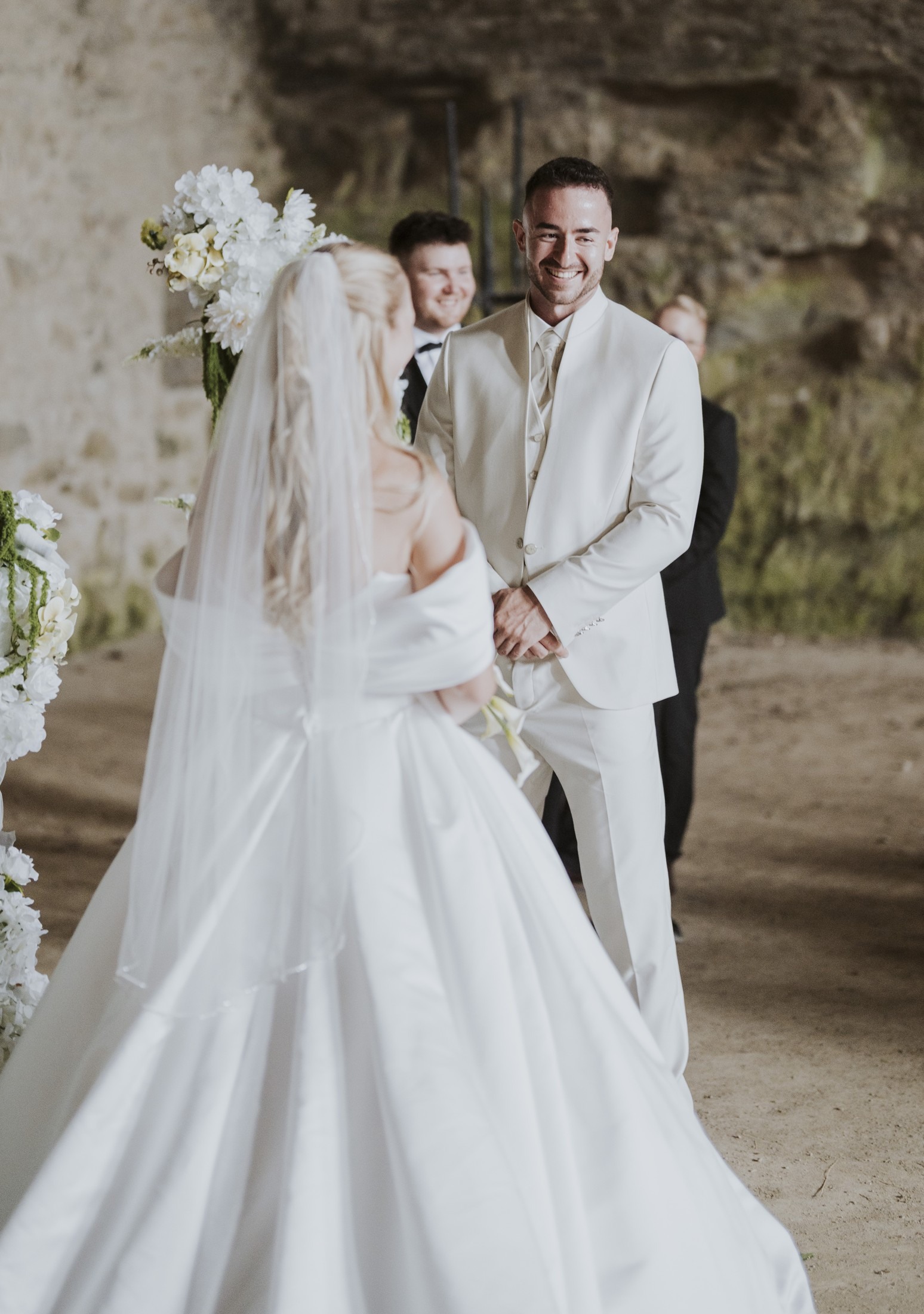 Nadja and Lucas in front of the ceremony arch.