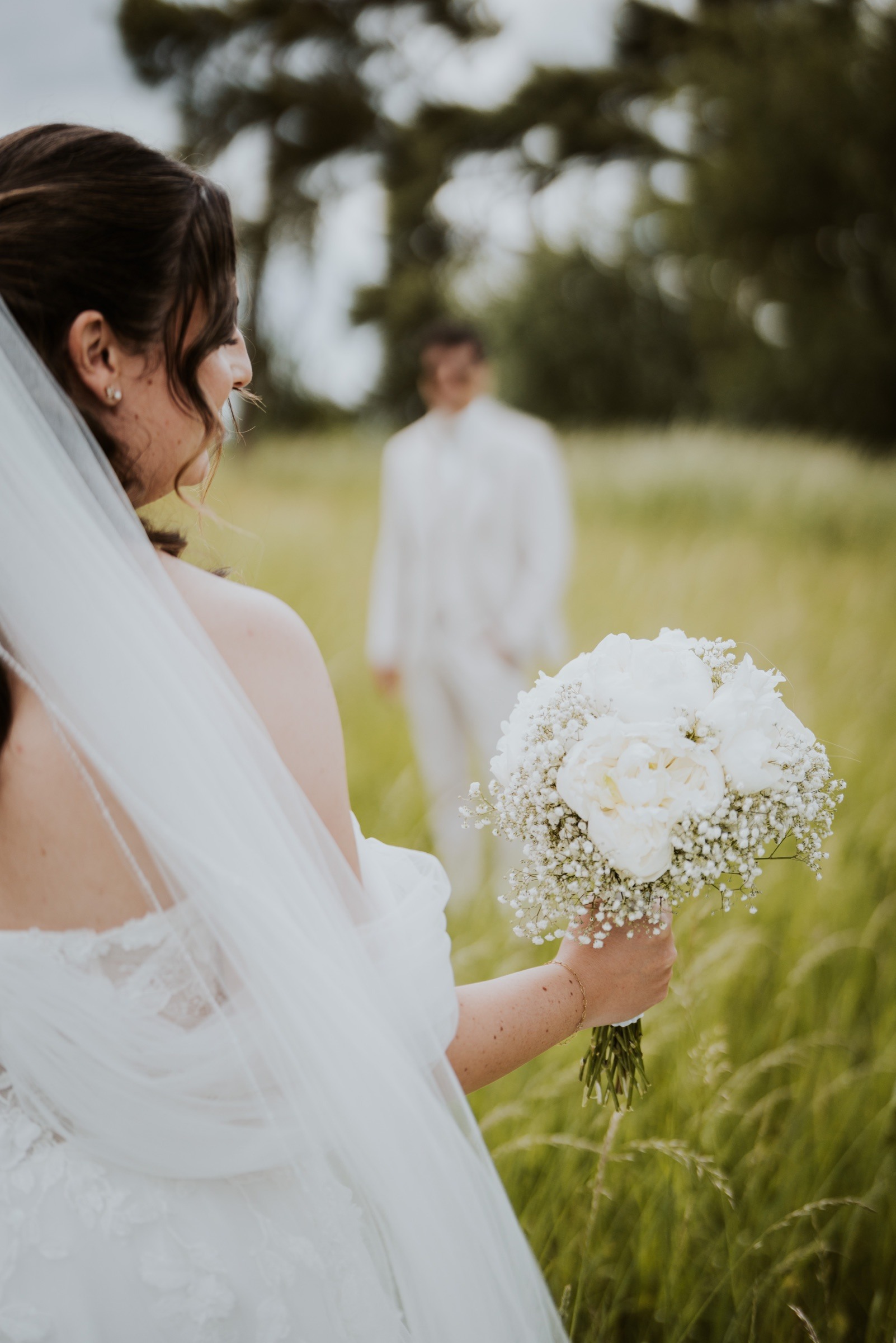 A bride in a meadow.