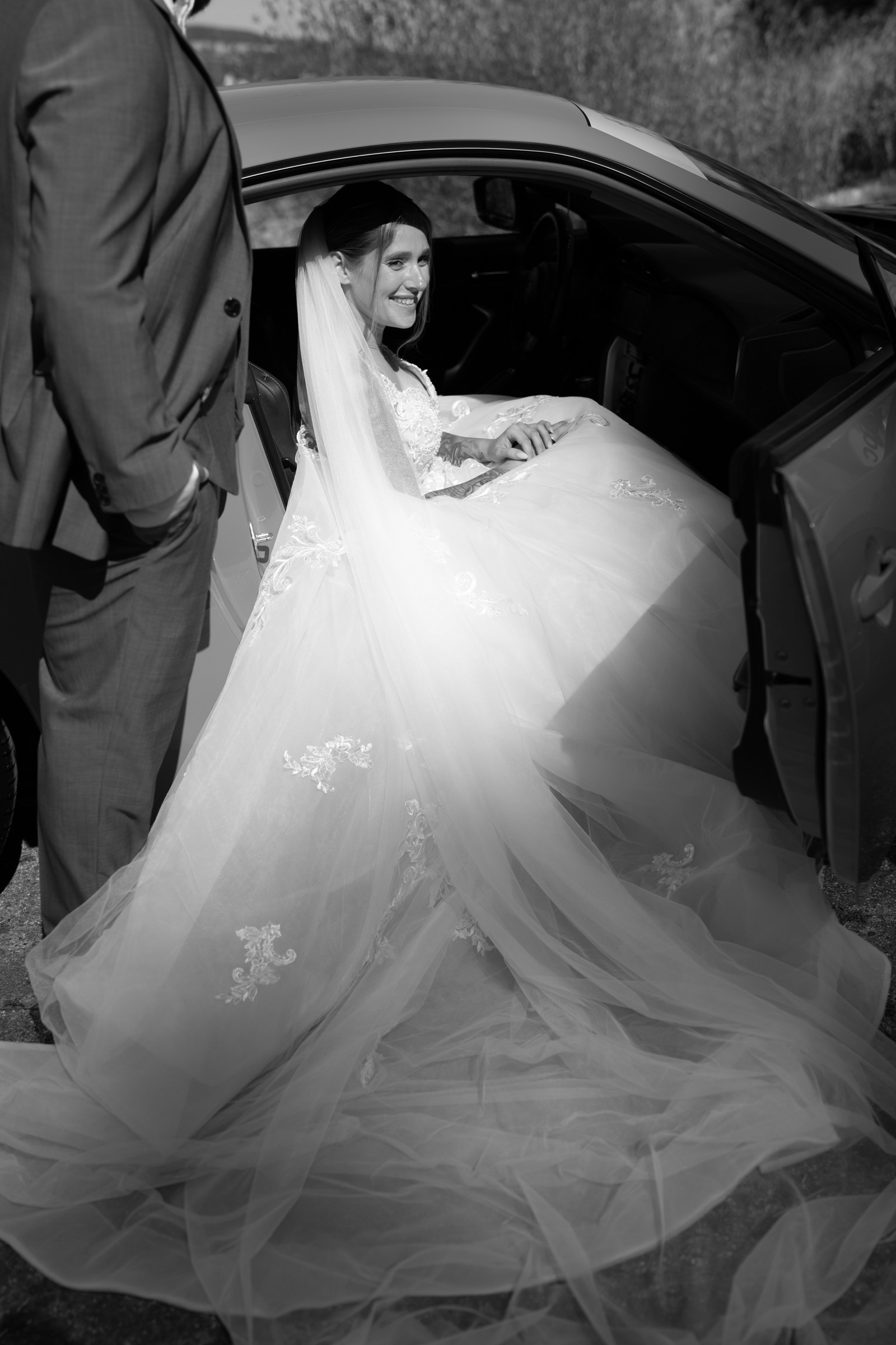 A bride in the wedding car.